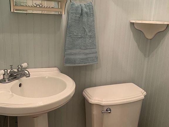 Half bath located in bedroom.