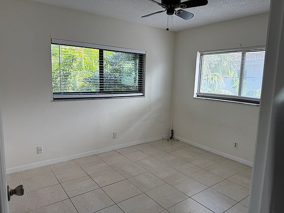 Equal sized bedrooms, one with two windows, and one with a larger closet.