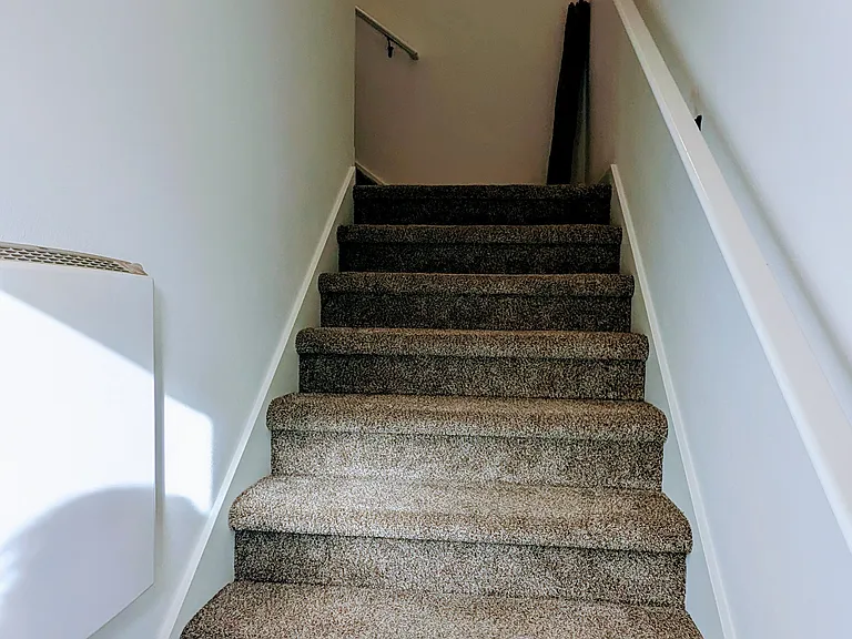 Stairway going up from entry door.