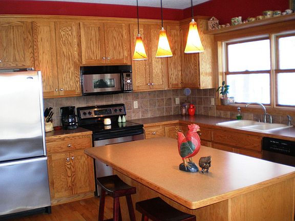 Bright open kitchen features stainless appliances