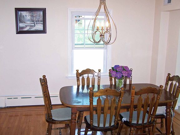 Dining Room w/Inlaid Hardwood Flooring & Tall Windows