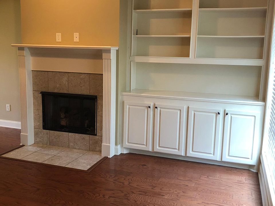 Family room with built-ins. Fireplace with gas logs.