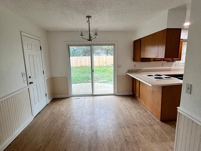 dining area with slider to rear yard