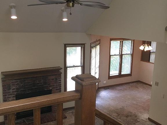 Upstairs view to living area and dining.
