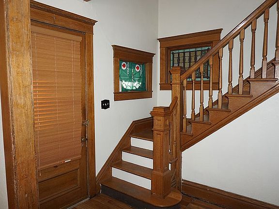 Entry and oak stairway.