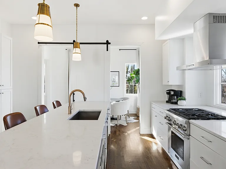 Fully equipped kitchen with stainless steel appliances, seating for 4 at the kitchen island, additional seating at the dining room table and all the dishware / utensils you might need.