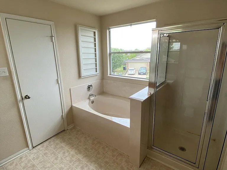 Primary bathroom shower and garden tub