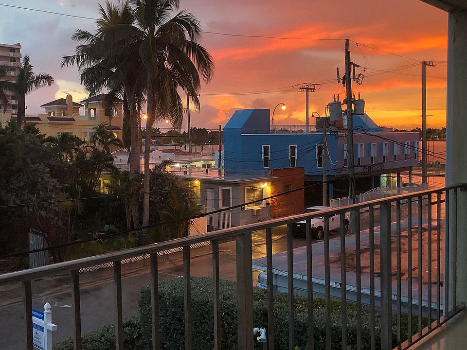 SUNSET OVER WATER ONBALCONY 