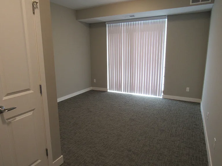 A master bedroom with access to the balcony.
