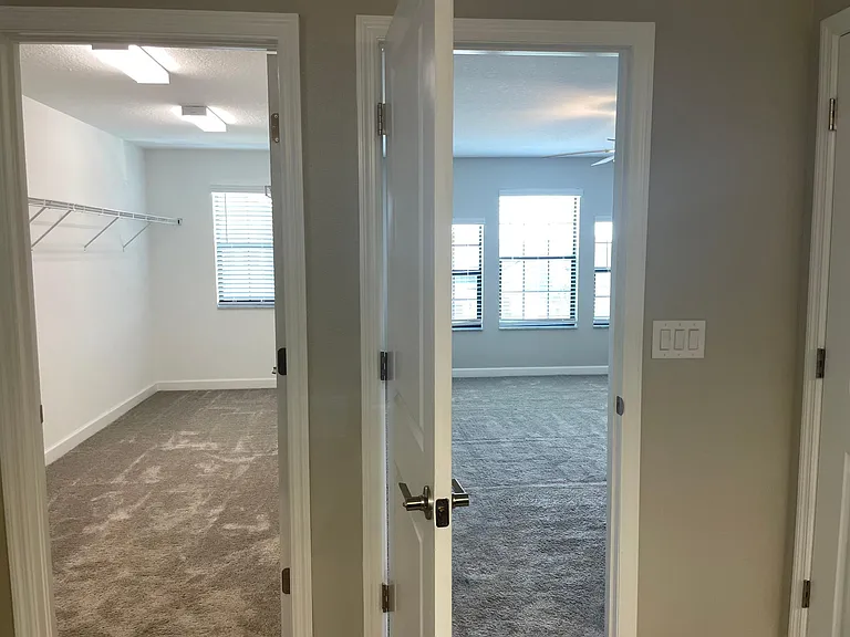 master walk in closet and master bed room