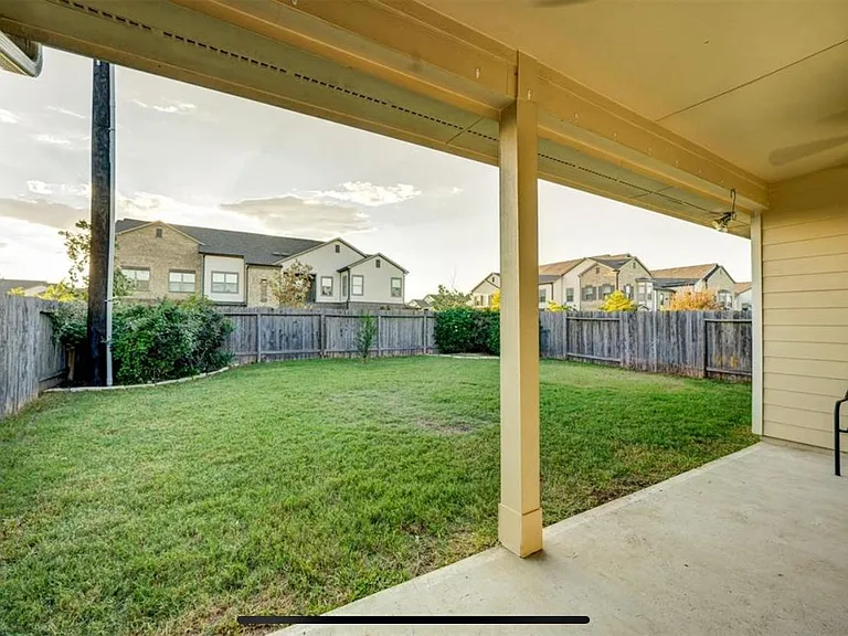 Covered double back porch and large fenced back yard.