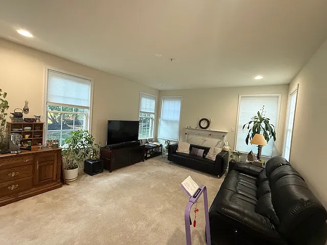 Lighted family room with 10 ft ceiling