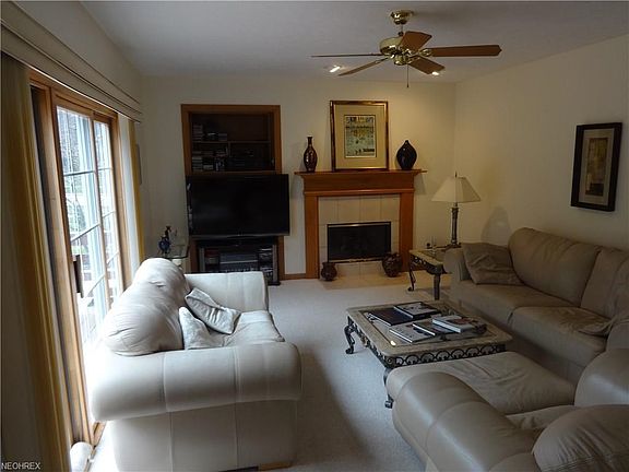 Family room with fireplace and slider leading to deck