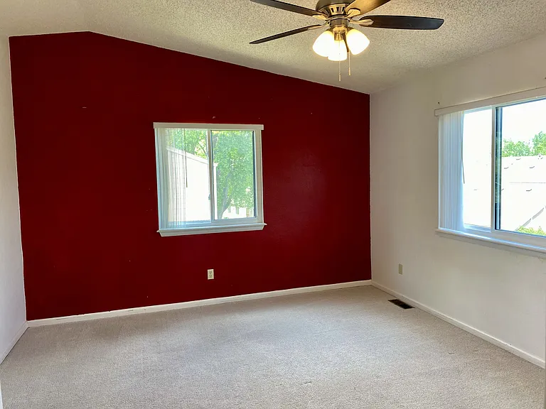 Primary bedroom with west-facing views of the foothills,