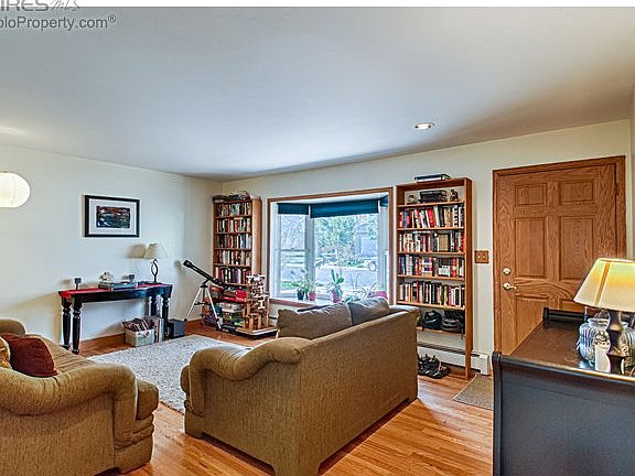 Living room with bay window off entry