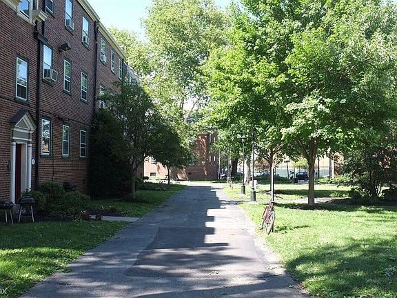 Courtyard with picnic benches and grilling stations.