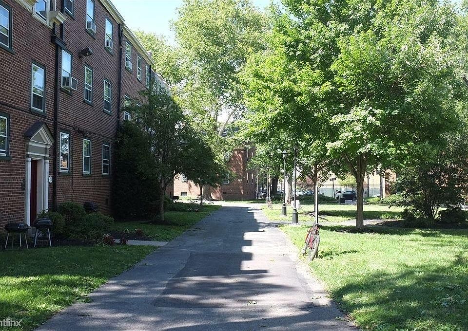 Courtyard with picnic benches and grilling stations.