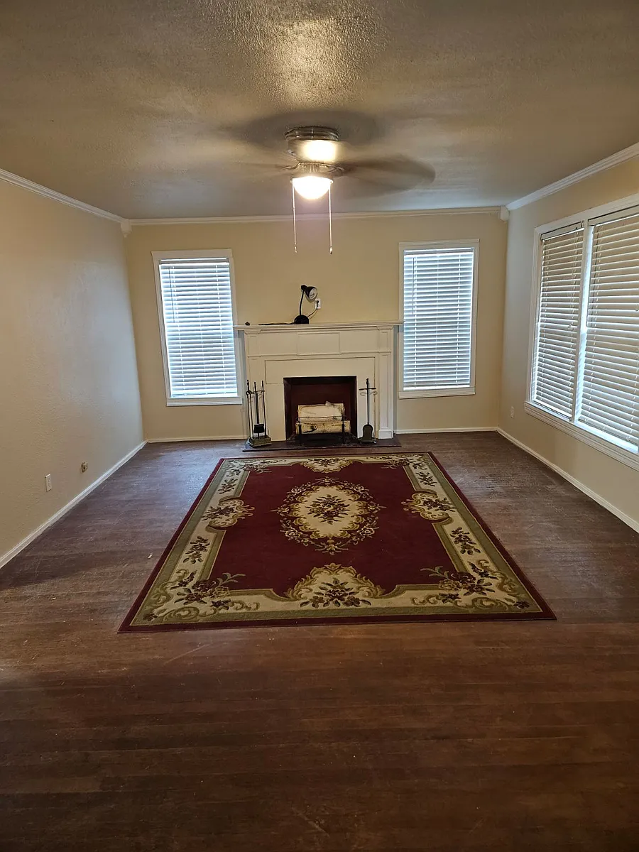 Large formal living room with fireplace and natural light - 720 N Englewood Ave