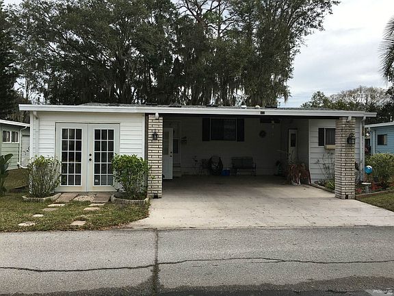 Front of Home with Attached Carport