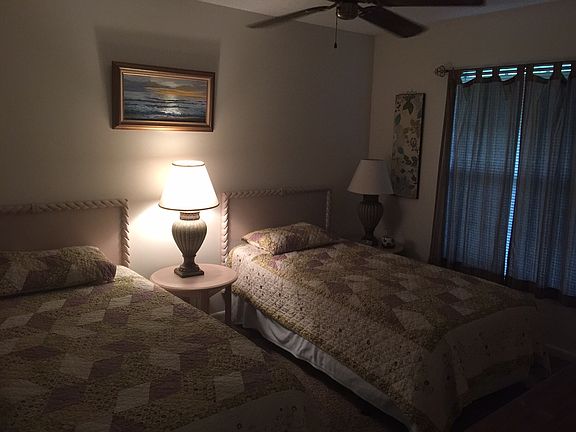 Guest bedroom with twin beds,dresser and night table