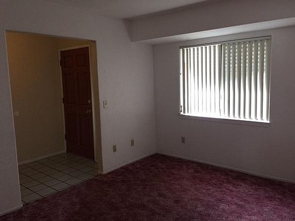 Den off entry way and kitchen