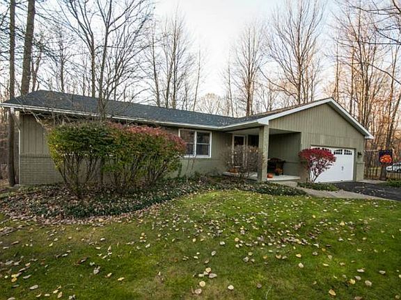 Nestled quietly on a large, private lot (130x335) in the heart of Larkin Township, this home was built in 1984, features city water and resides in the Dow High, Jefferson Middle and Woodcrest Elementary School Districts. Take a look at the brand new roof!