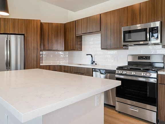 Kitchen with Quartz Countertops and Stainless Steel Appliances