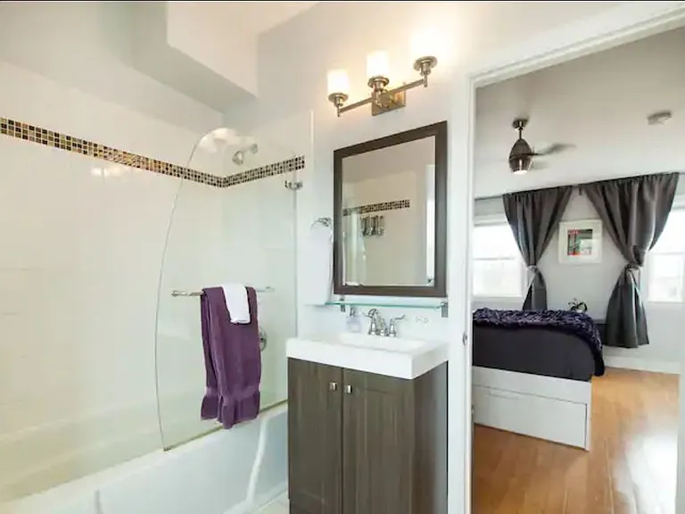 Second bedroom en suite bath with shower and tub