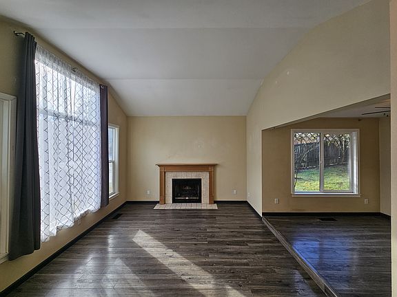 Great room with wood burning fireplace.