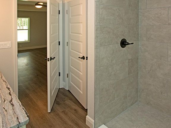 Tile shower , granite counters , craftsman doors .
