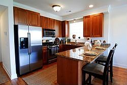 Kitchen with large breakfast bar.