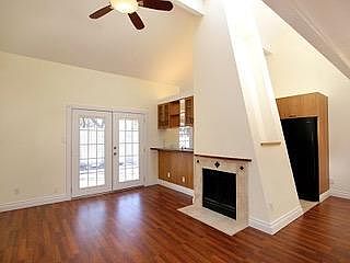 Large family room with kitchen. Large windows and skylight.