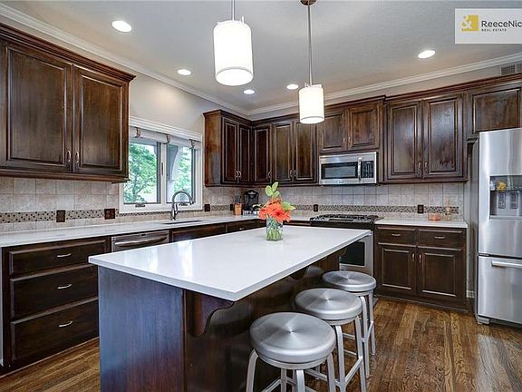 Kitchen features quartz counters, tons of counter space.