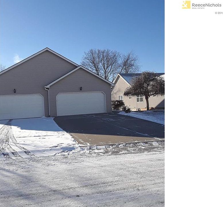 Lovely, two car garage duplex with vinyl siding and newer roof.