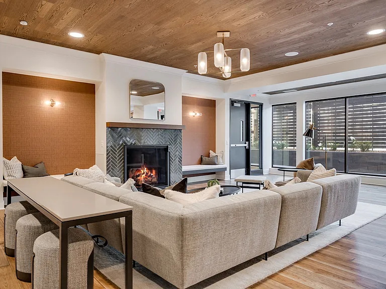 Connect with neighbors in our cozy community room with a fireplace.