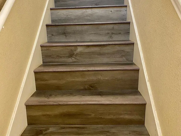 Luxury vinyl plank stairs to the second floor