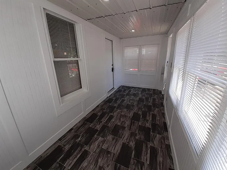 Bright enclosed Sunporch/Mudroom.
