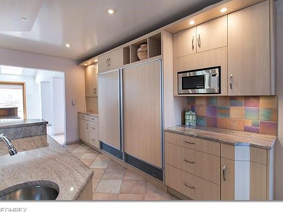 Custom lighting, Vegetable sink, terrific access as Kitchen is central to layout..