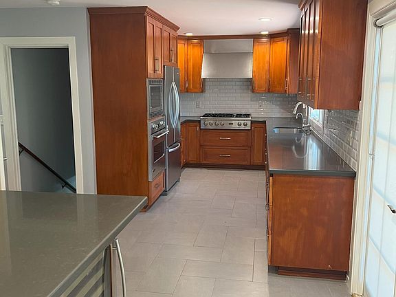 Stainless steel and cherry kitchen