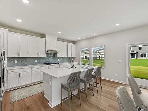 Kitchen in the Dakota floorplan at a Meritage Homes community in Garner, NC.