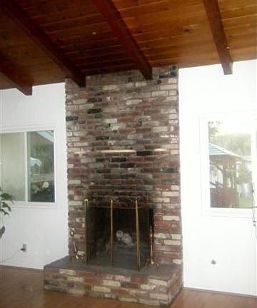 floor to ceiling brick fireplace in dining room