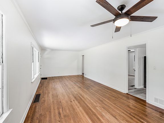 Living room. All original wood floors and windows fully restored. All new and restored doors and hardware.