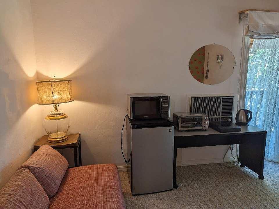 mini fridge, microwave, toaster oven, stove top and hot water for tea.