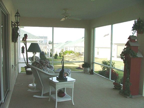 Relax on your expanded carpeted lanai with two ceiling fans. Offset for privacy!