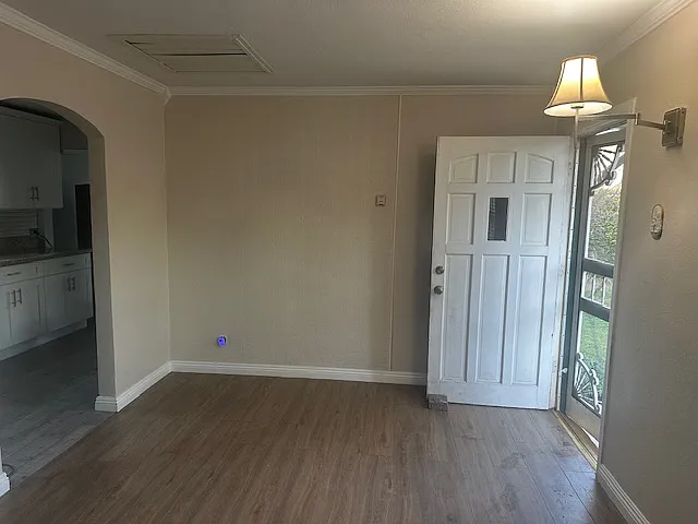 Other side of living room. Front door.