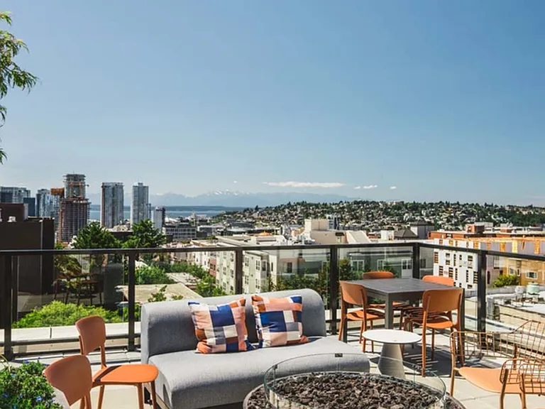 Rooftop relaxation and stunning mountain views await you at Modera Broadway