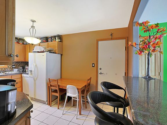 5th image of 9852 W Lawrence Ct #3N