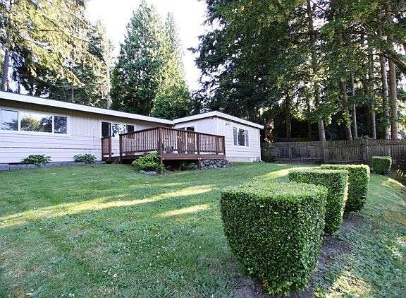 Fully fenced backyard with deck.