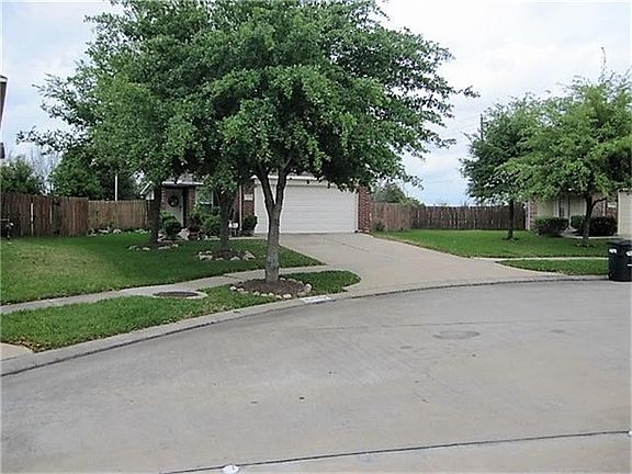 FRONT YARD SHADED BY MATURE TREES