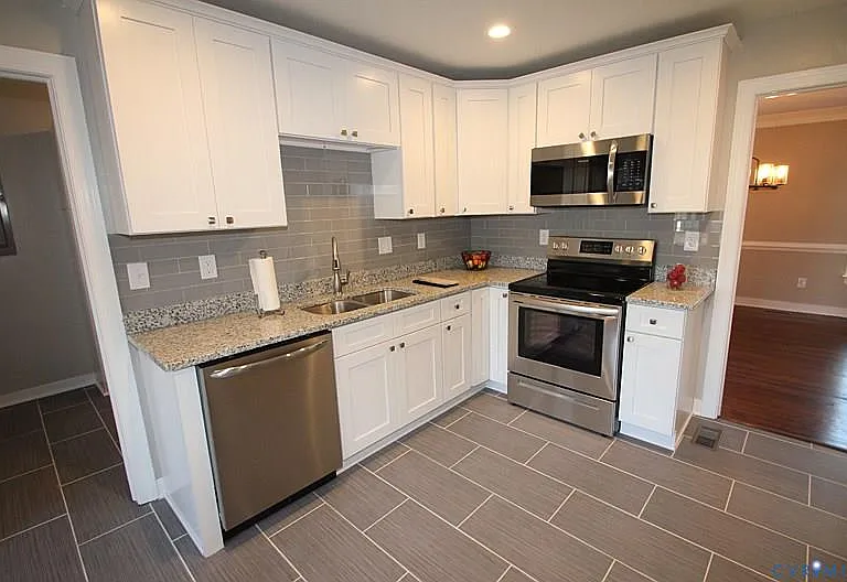 Stunning tile flooring, gleaming granite tops, recessed lighting & so much more!